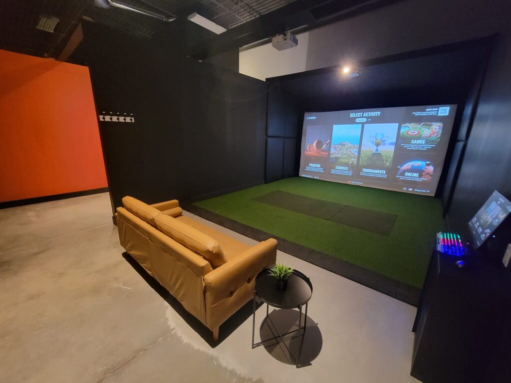 Modern indoor golf facility at Shotgun Golf in Bradford, featuring advanced simulators and a comfortable atmosphere for year-round play.